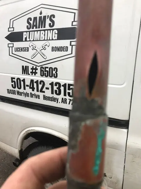 image4 broken pipe in front of Sam's Plumbing work Truck
